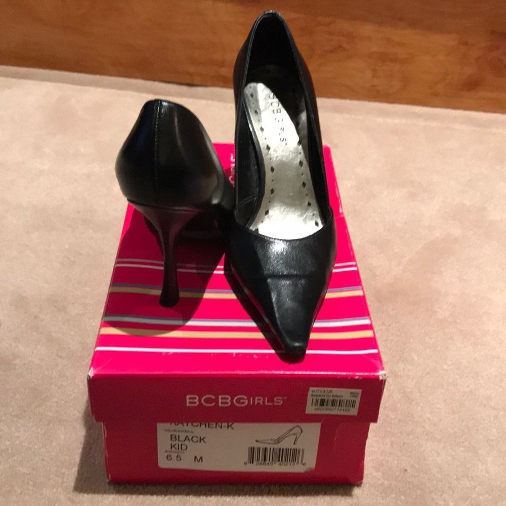 Black pointed toe pumps